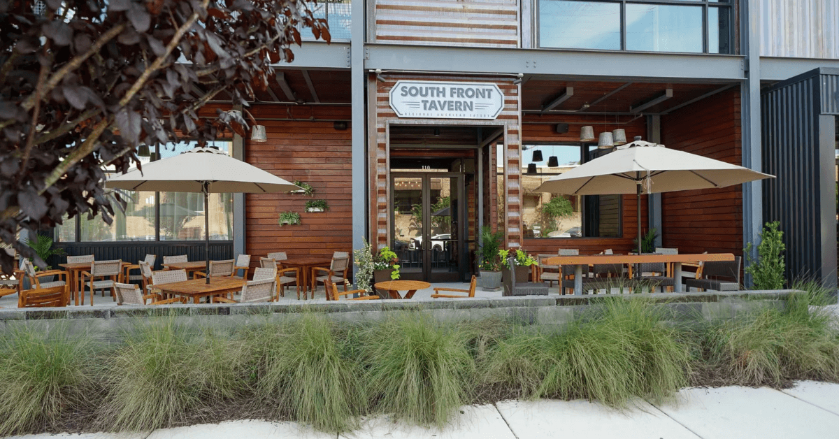 South Front District streetscape with South Front Tavern’s welcoming windows and signage