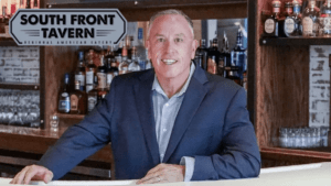 Owner Mark Zecher welcoming guests at South Front Tavern anniversary celebration in Wilmington NC