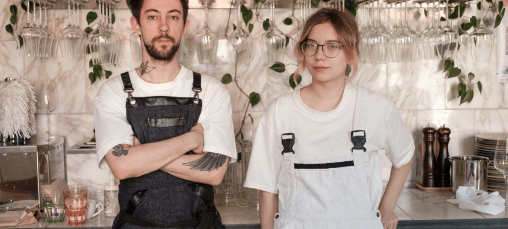 Two people working together in a small business, highlighting teamwork, local entrepreneurship, and independent business ownership in Wilmington, NC.