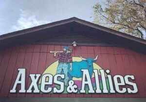 Front entrance of Axes and Allies axe-throwing venue in downtown Wilmington